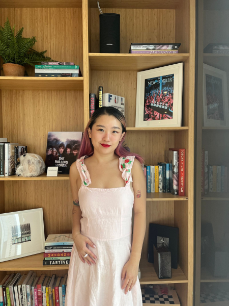 A photo of Allure commerce editor Sarah Han wearing Cakes Sticky Cakes Circles underneath a light pink dress